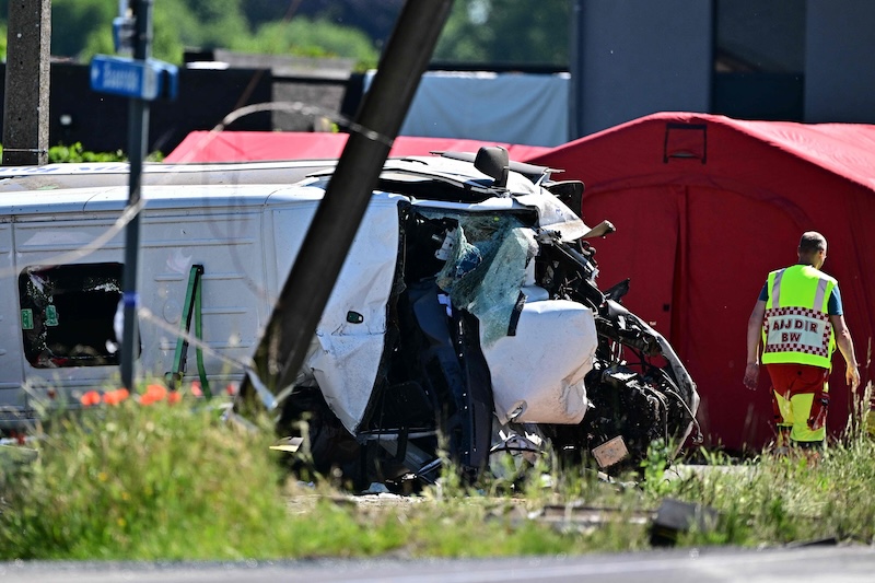 Train hits school bus in Belgium, four dead