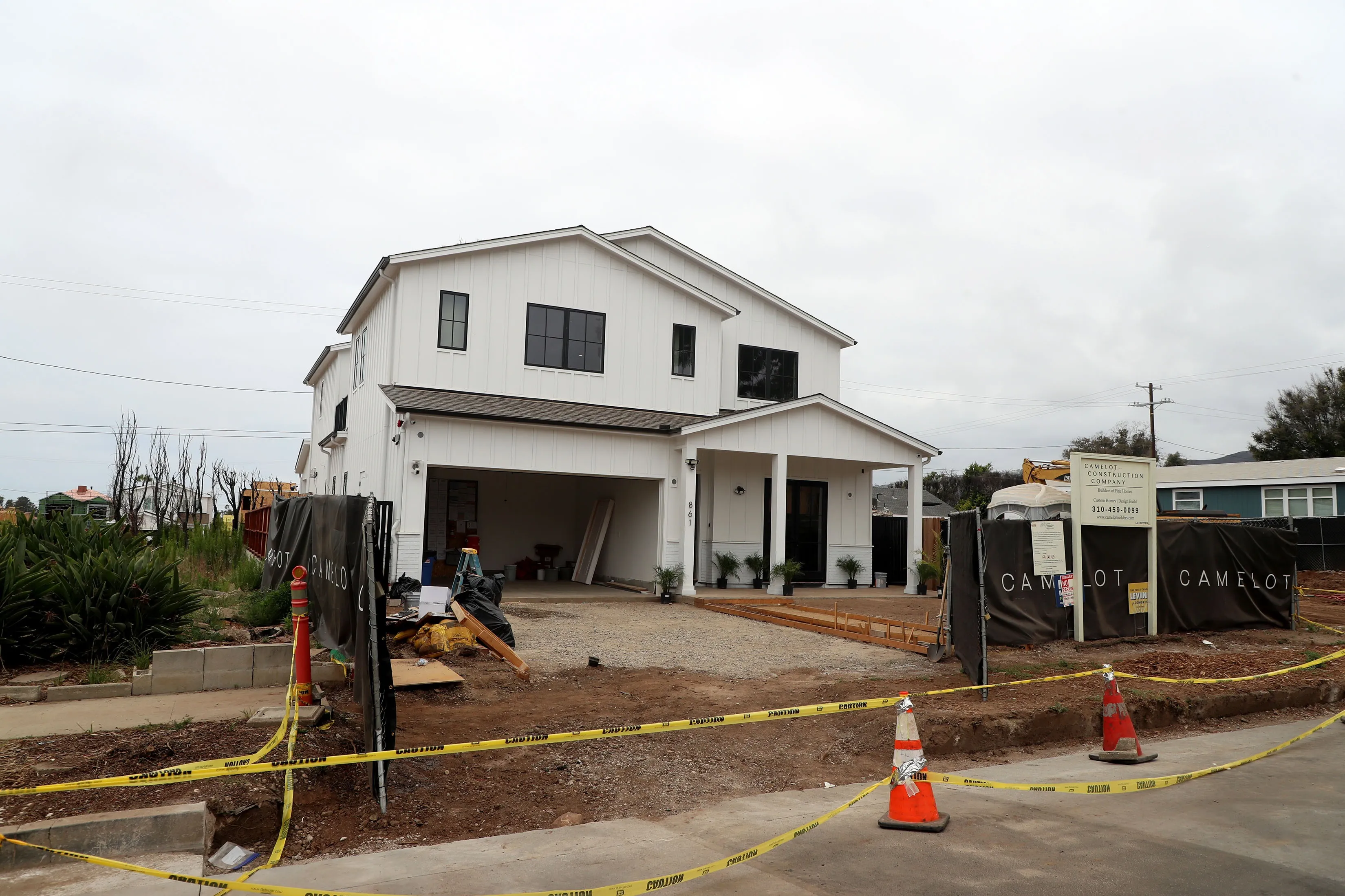 The new sound in Pacific Palisades: Hammers on nails