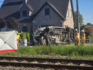 Several hurt in a crash between a train and a minibus, Belgian police say