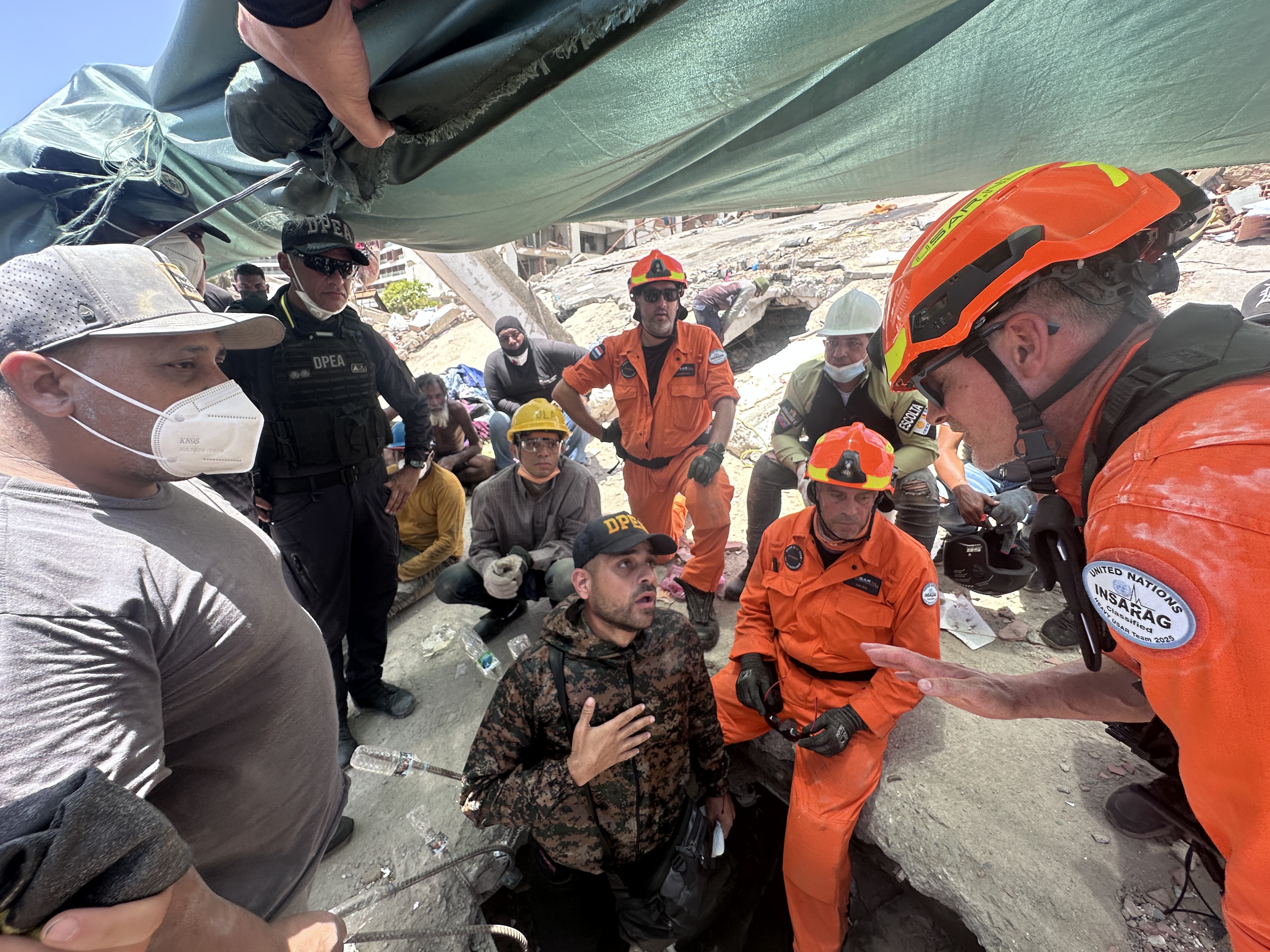 Venezuelans now face grim and daunting task of recovering bodies from devastated areas