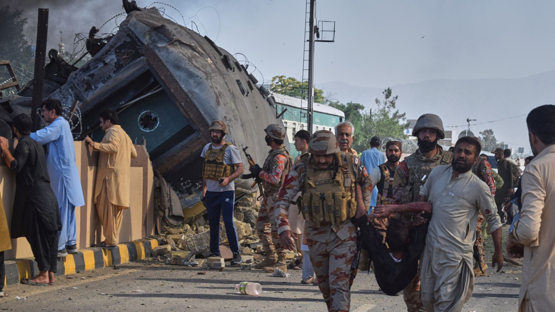 More than 30 people die after suicide bomber in Pakistan targets train carrying military personnel