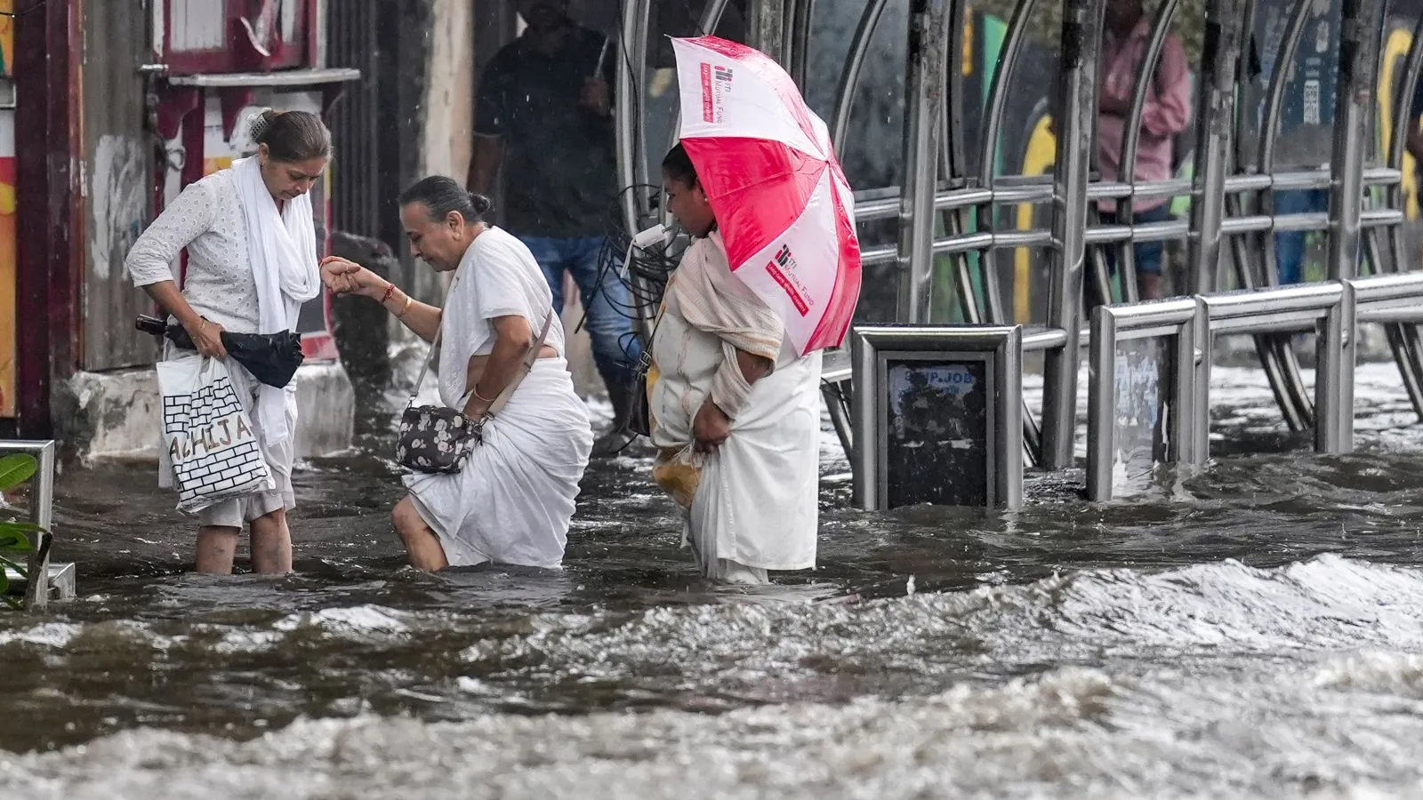 Tracks cave in, trains stall, buses break down as monsoon rain disrupts Mumbai