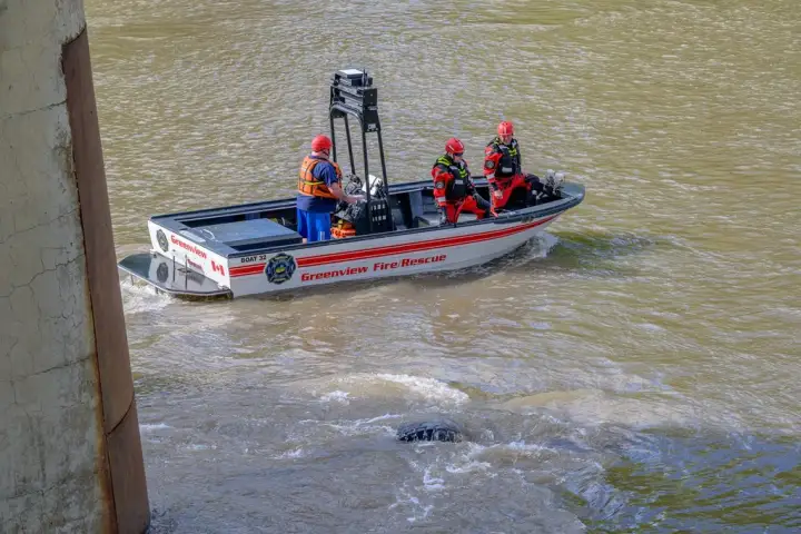 Driver missing after crane goes over bridge and into river in northern Alberta: RCMP