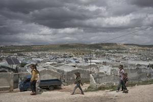 Cash-strapped Syrians living in tent settlements struggle to return home after Assad's fall